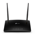 Black TP-Link router with antennas on a white background